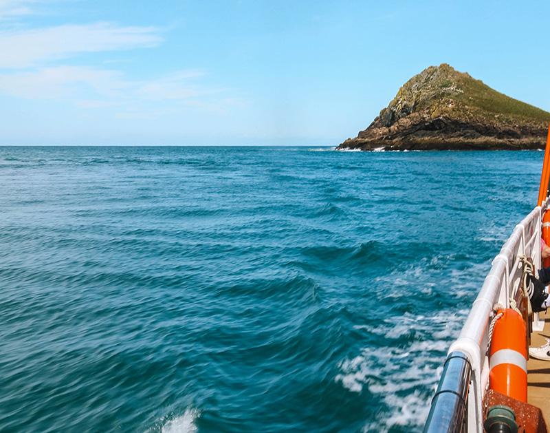 A small fishing boat heading out from Padstow harbour for a sea-fishing trip, Cornwall