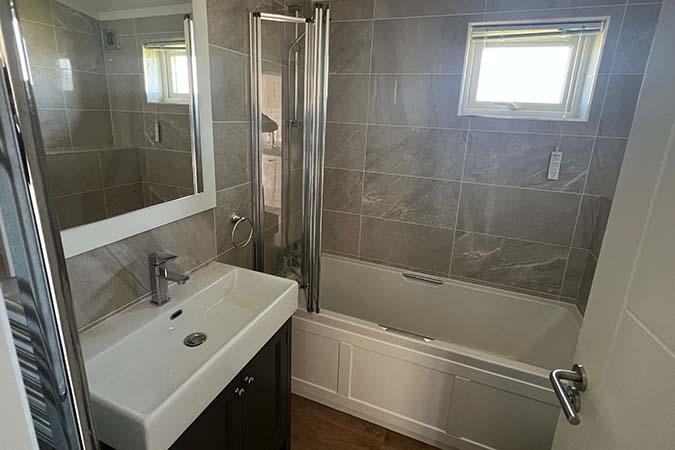 One of two bathrooms inside a luxury lodge at Atlantic Bays Holiday Park