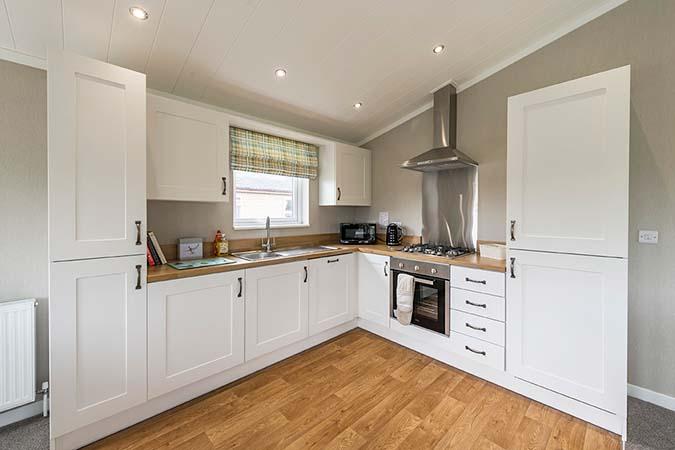 Modern fitted kitchen inside a luxury lodge at Atlantic Bays Holiday Park
